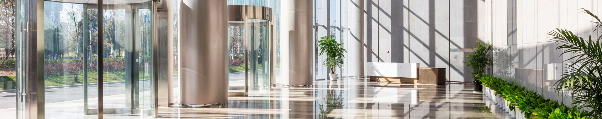 Modern office lobby with plants.