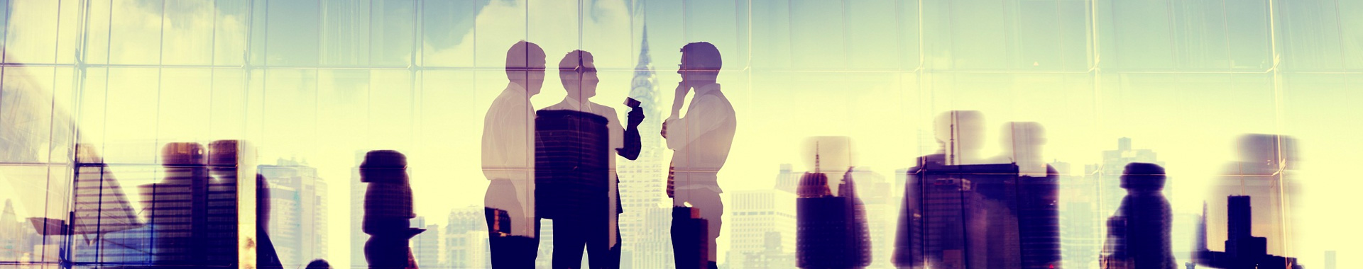 Business silhouettes over city skyline.