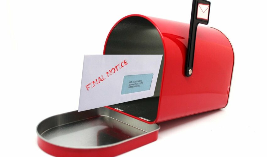 A red mailbox with its door open contains a white envelope stamped "FINAL NOTICE" in red.